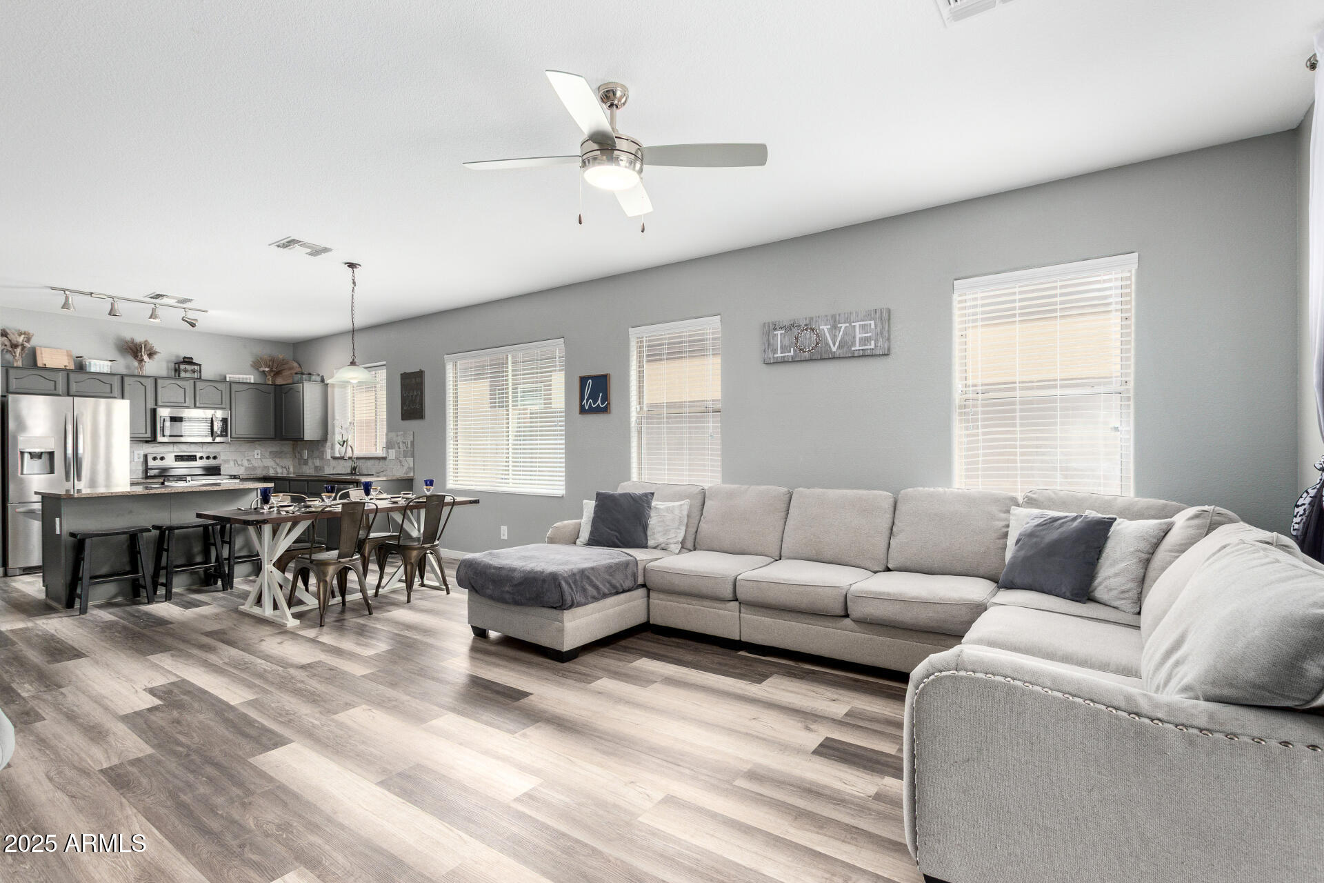 10543 East Flossmoor Avenue Mesa, AZ 85208 - Photo 2 of 8 a living room with furniture and a fireplace