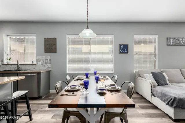 a view of a dining room with furniture window and outside view
