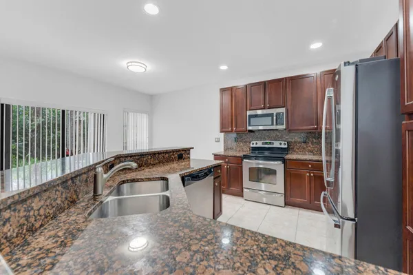 $490,000 | 6077 Grand Cypress Circle West, Coconut Creek, FL 33073