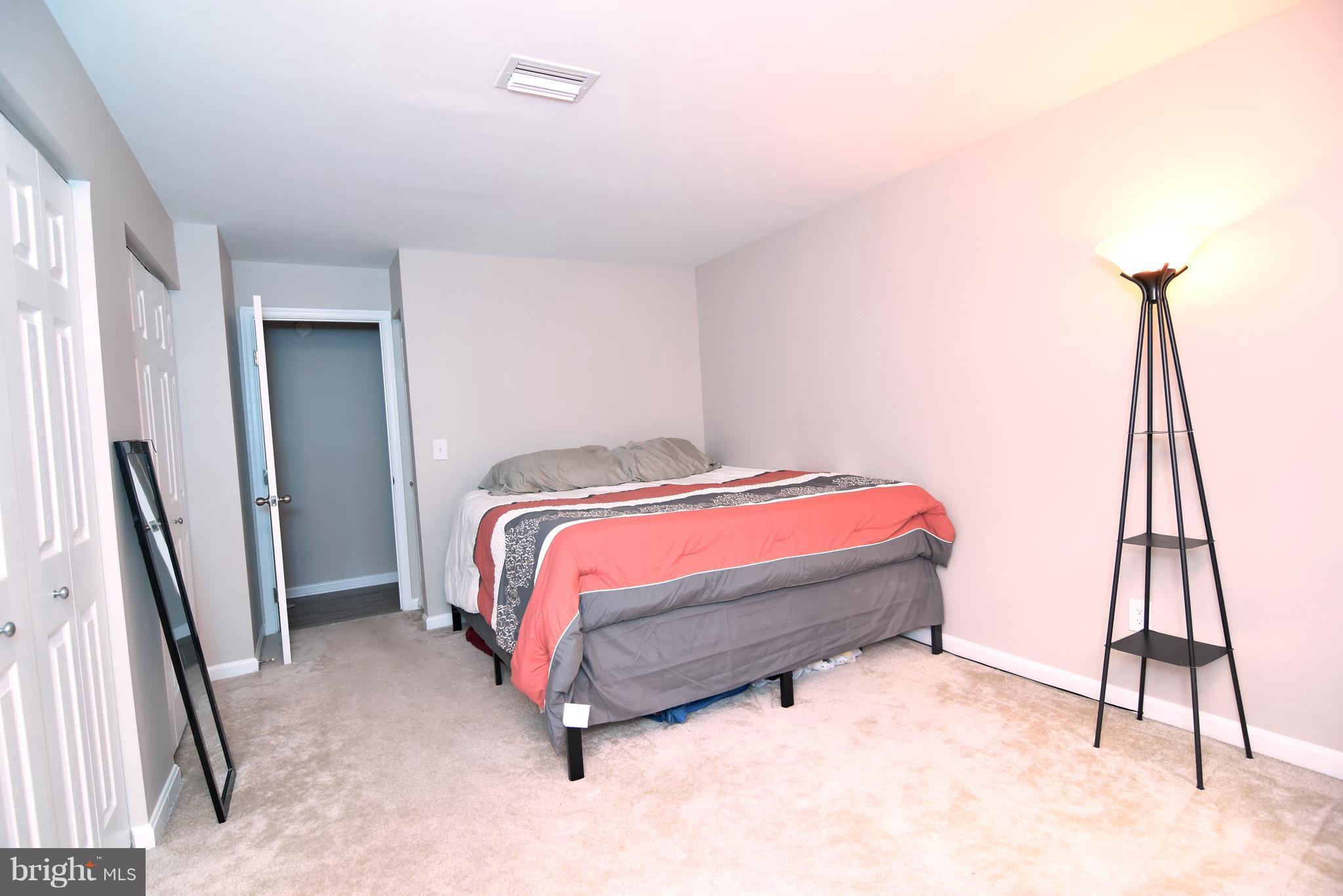 14903 Rydell Road, Unit 204 Centreville, VA 20121 - Photo 8 of 16 a bedroom with a bed and a window