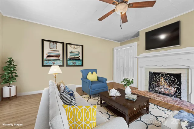 a living room with furniture and a flat screen tv