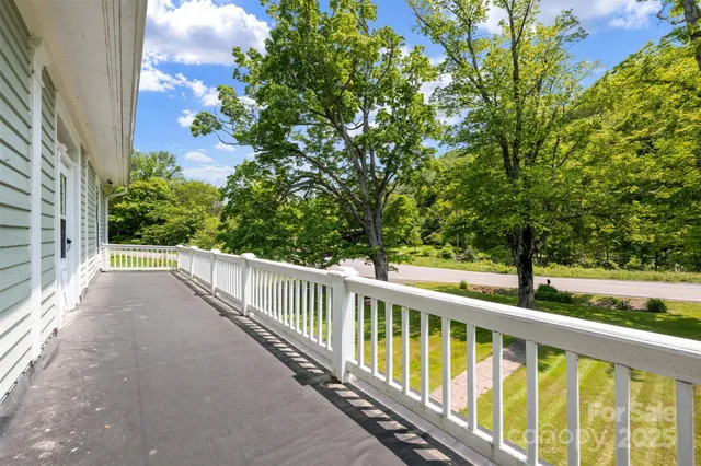 a view of balcony with yard