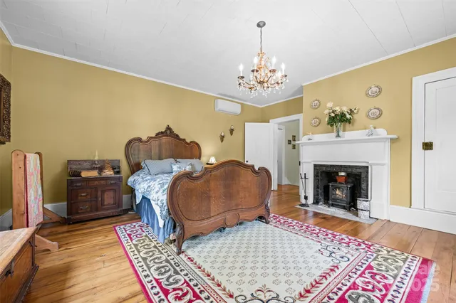 a living room with furniture rug and fireplace