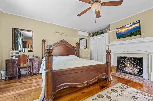 a bed room with a bed and a fireplace