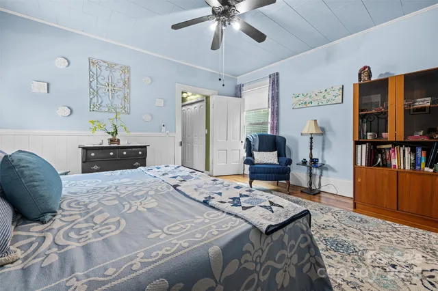 a bedroom with a bed and furniture