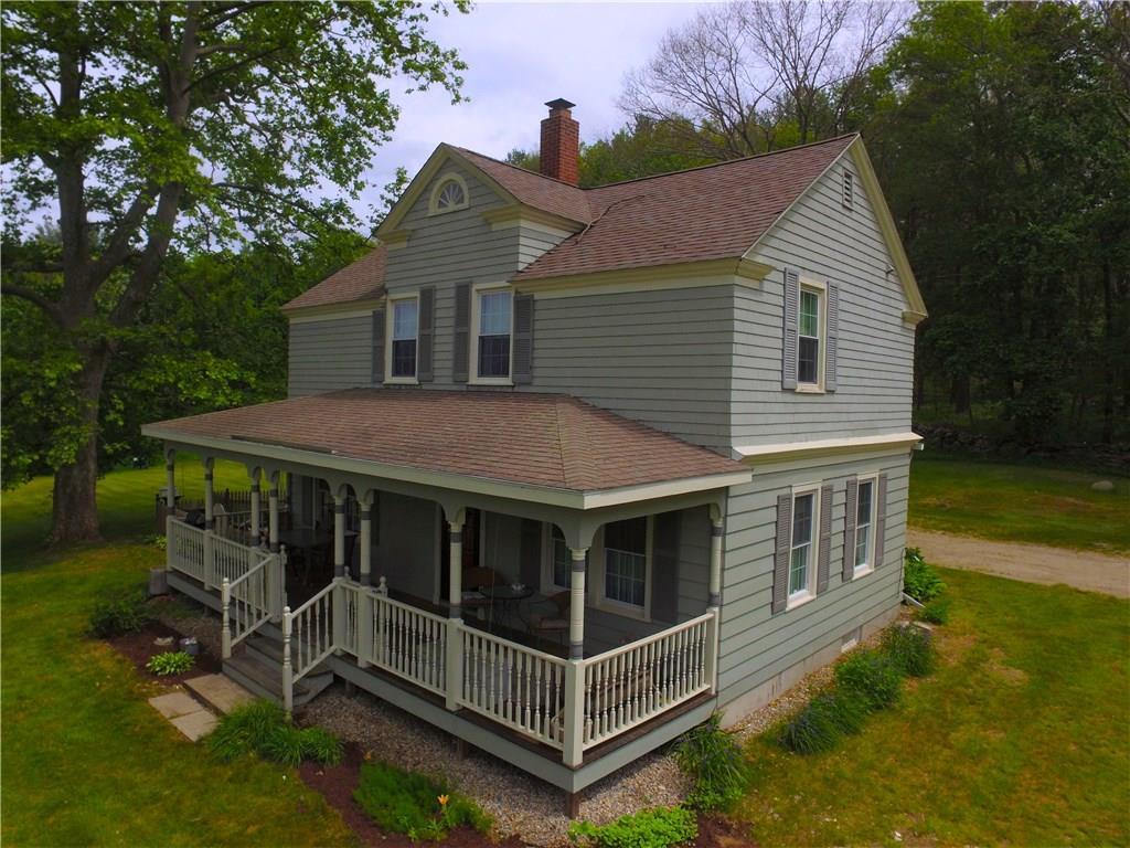 8 Pompeo Road Thompson, CT 06255 - Photo 1 of 1 a view of a house with a yard and wooden deck