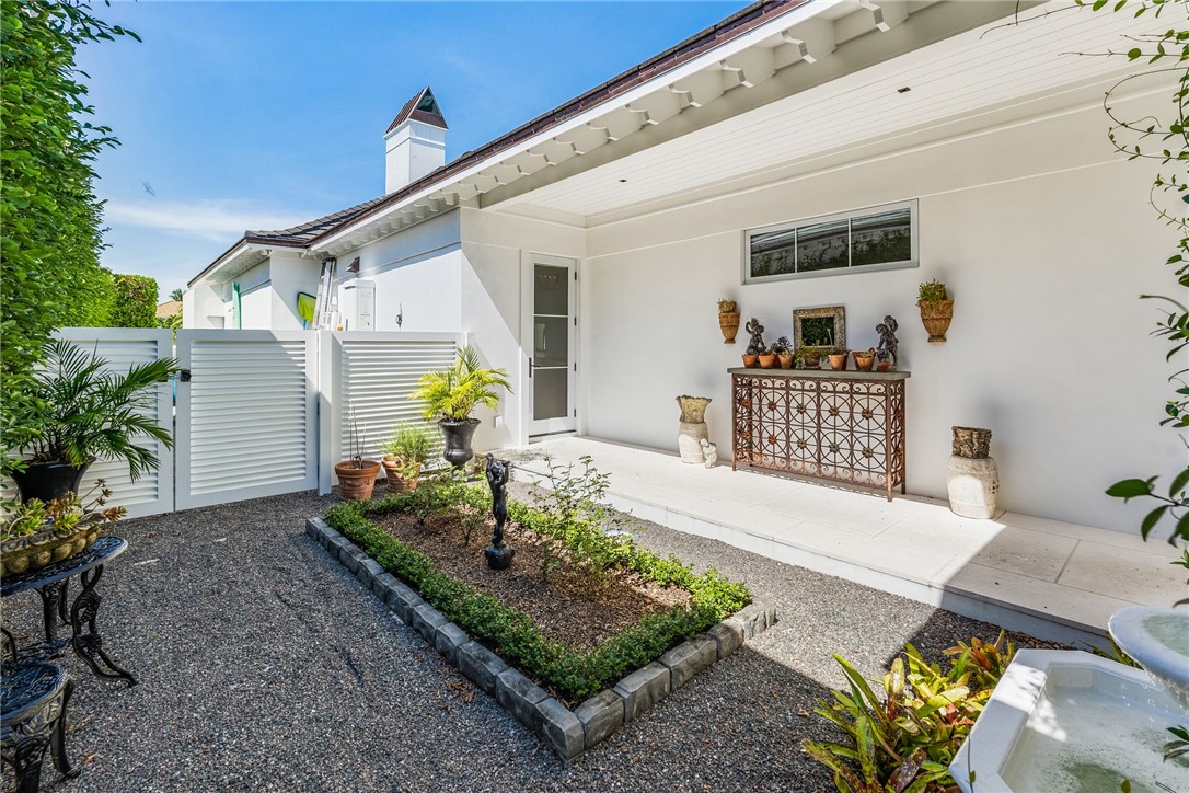 61 Caribe Way Vero Beach, FL 32963 - Photo 19 of 36 a front view of a house with garden