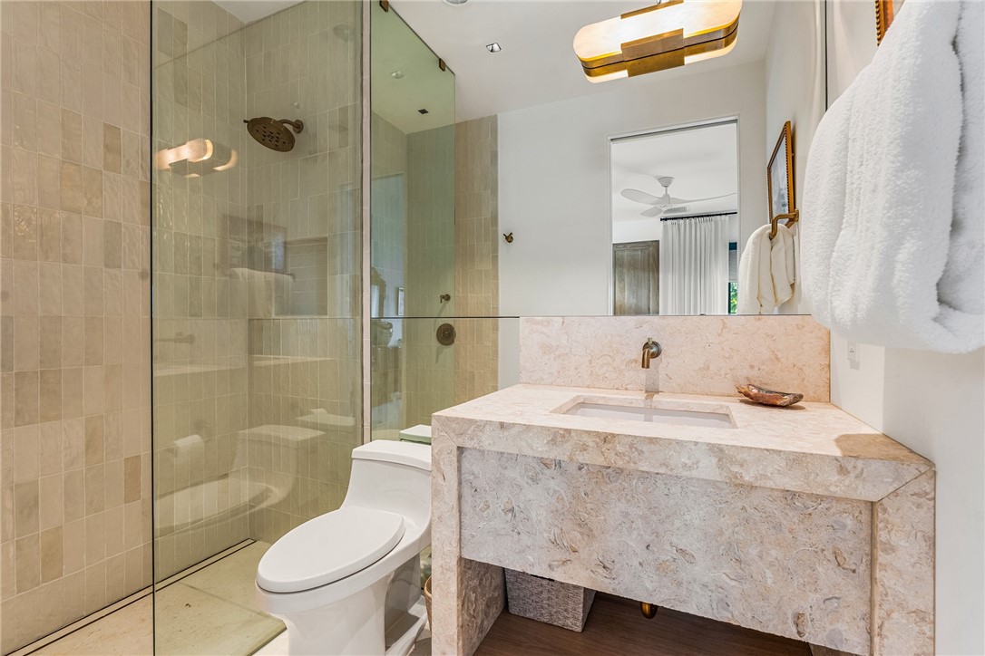 61 Caribe Way Vero Beach, FL 32963 - Photo 21 of 36 a bathroom with a sink toilet and shower