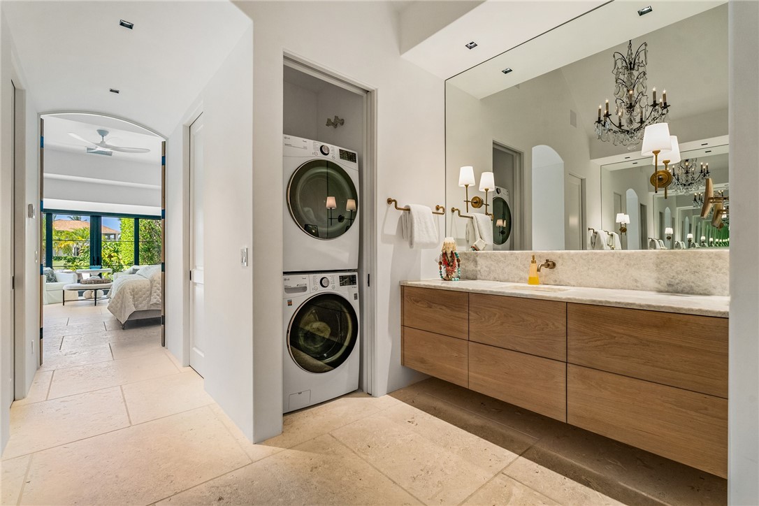 61 Caribe Way Vero Beach, FL 32963 - Photo 26 of 36 a spacious bathroom with a sink mirror and vanity