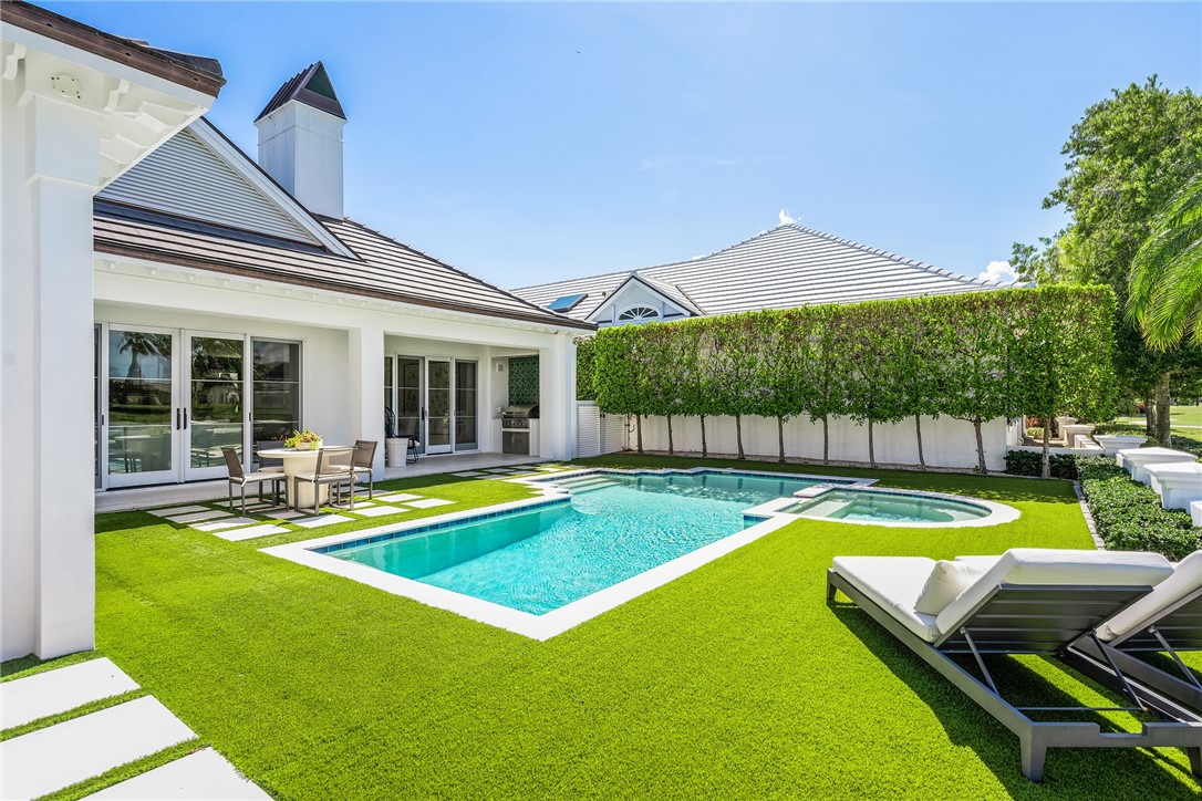 61 Caribe Way Vero Beach, FL 32963 - Photo 29 of 36 a view of a house with swimming pool and sitting area