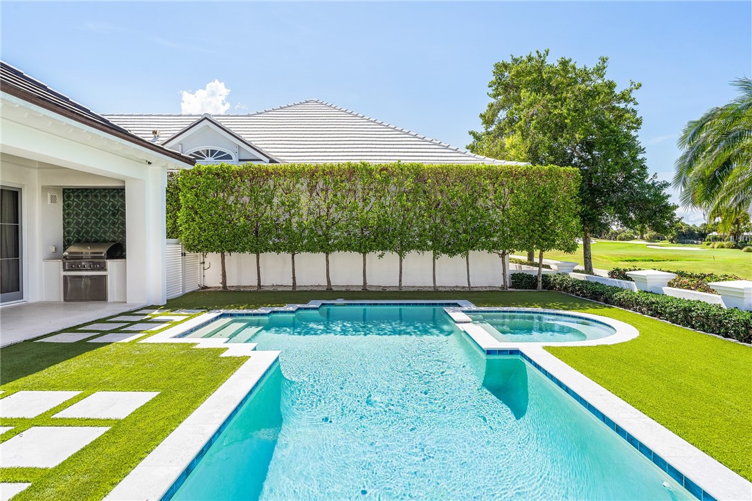 61 Caribe Way Vero Beach, FL 32963 - Photo 30 of 36 a view of a backyard with swimming pool