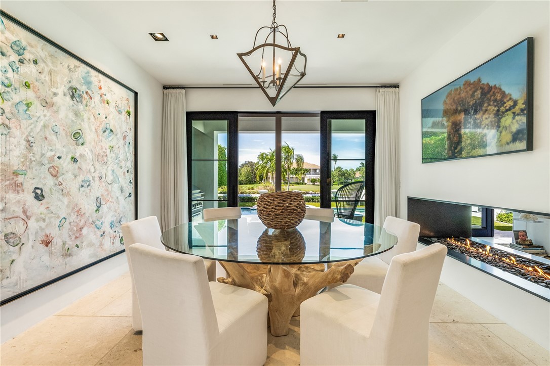 61 Caribe Way Vero Beach, FL 32963 - Photo 3 of 36 a dining room with large window