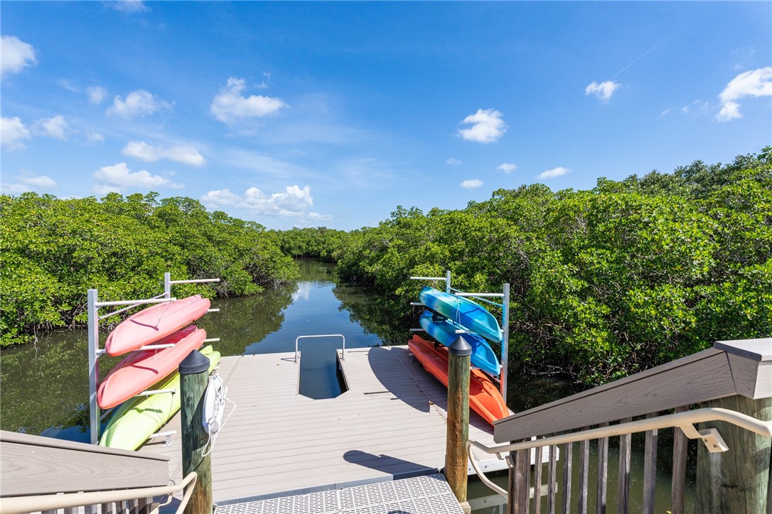61 Caribe Way Vero Beach, FL 32963 - Photo 33 of 36 a street view with sitting space and garden