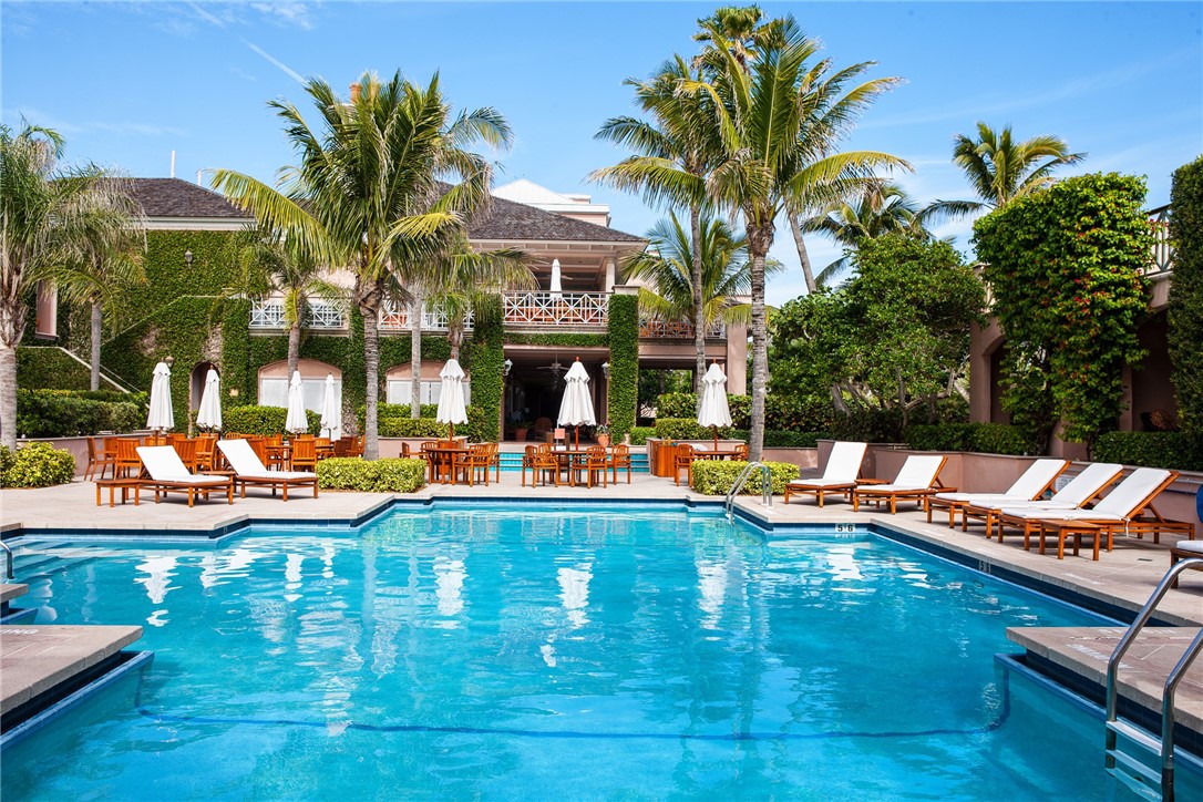61 Caribe Way Vero Beach, FL 32963 - Photo 35 of 36 a view of a swimming pool with a table and chairs