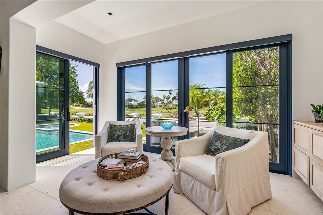 61 Caribe Way Vero Beach, FL 32963 - Photo 6 of 36 a living room with furniture and a large window