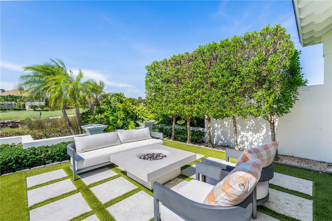 61 Caribe Way Vero Beach, FL 32963 - Photo 7 of 36 a view of yard from outdoor seating area