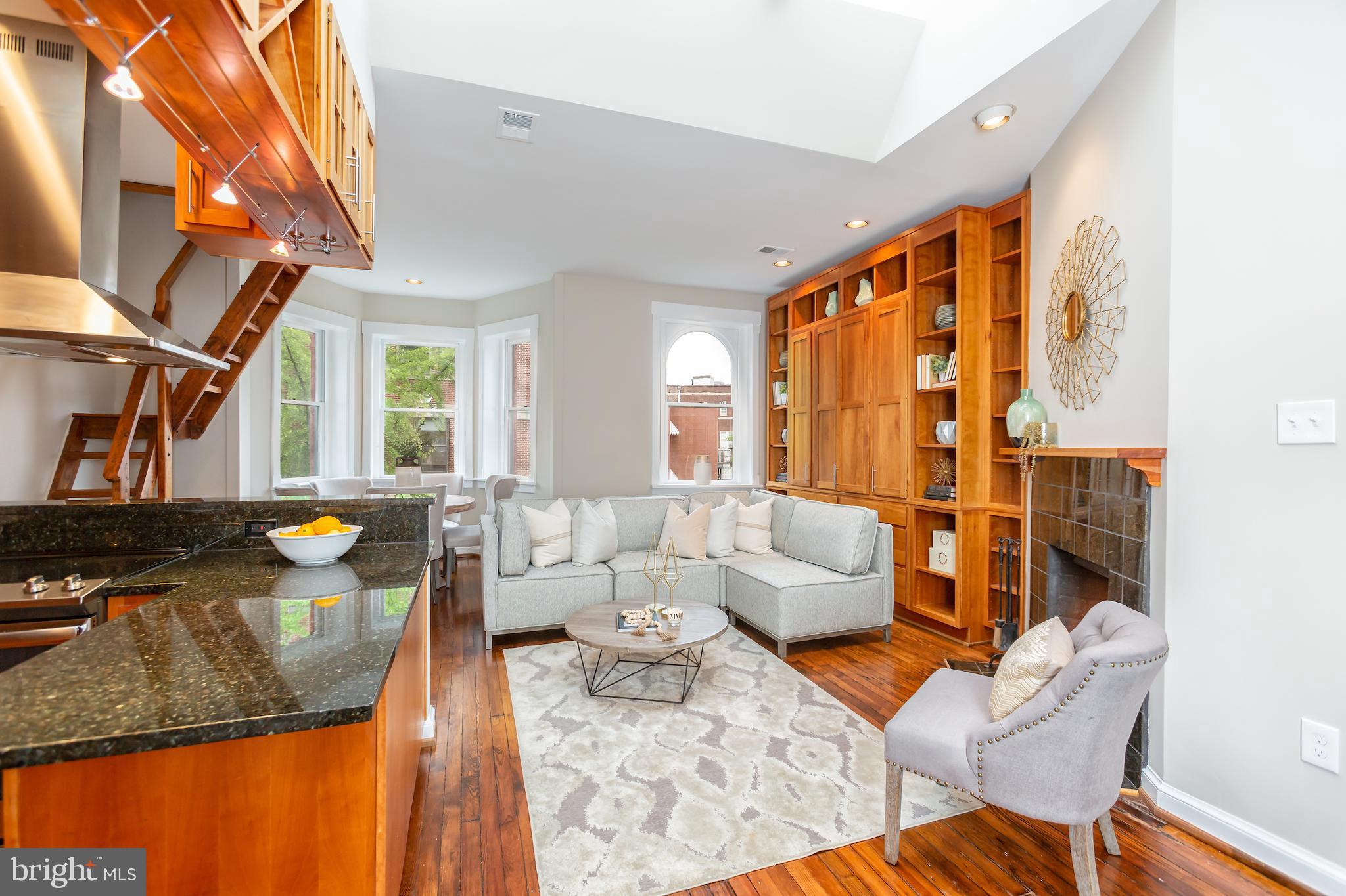 1762 Corcoran Street Northwest, Unit 4 Washington, DC 20009 - Photo 2 of 24 Living room with 10'+ ceilings and skylight