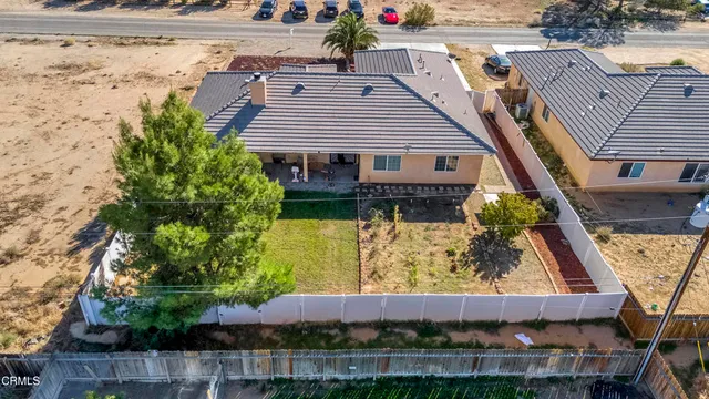 an aerial view of a house with a garden