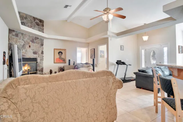 a bed room with a bed mirror and a chair