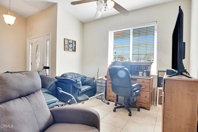 a work room with furniture and a window