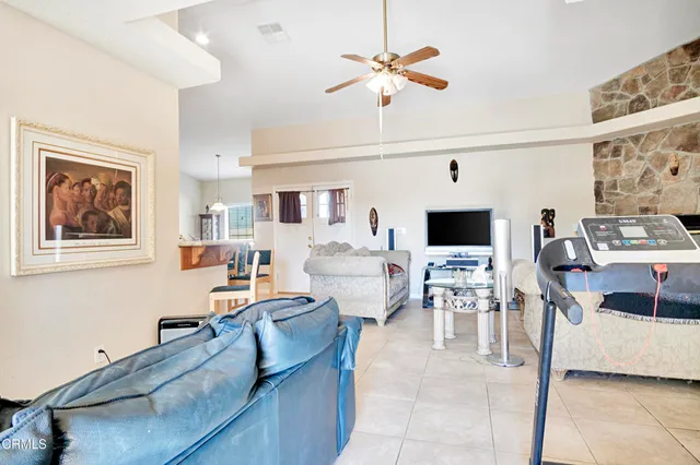 a living room with furniture and flat screen tv