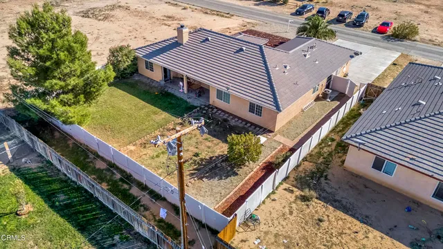 a view of a backyard with sitting area