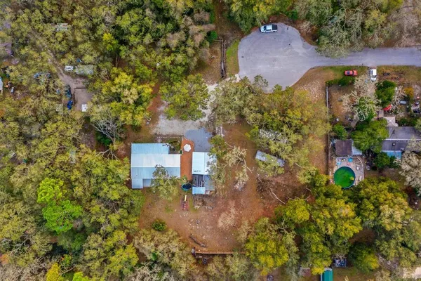 an aerial view of a house with a garden