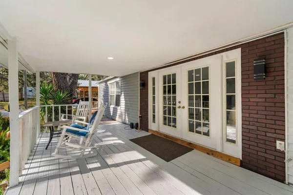 a view of a balcony with chairs