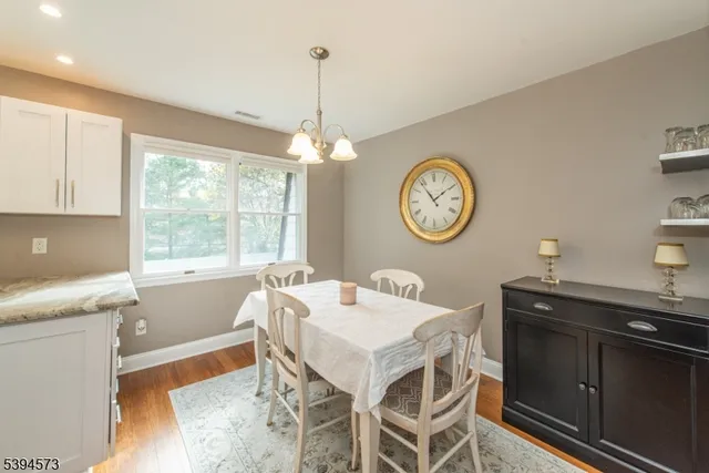a very nice looking dining room with a table and chairs