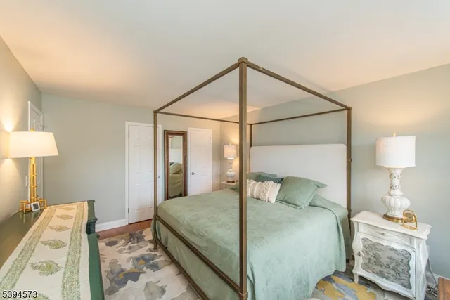 a bedroom with a bed and a lamp