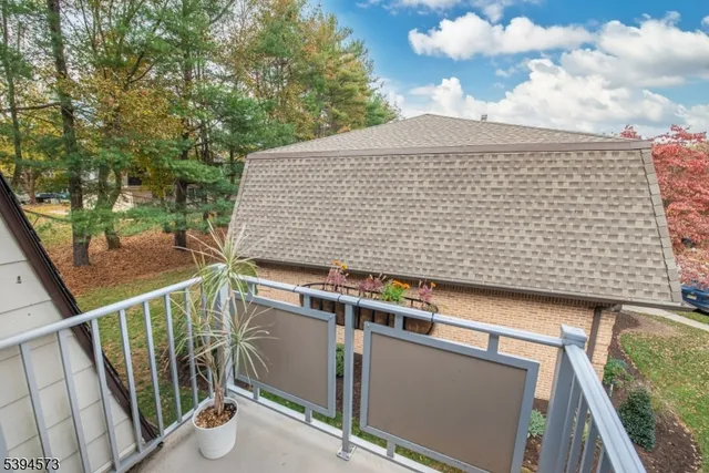 a view of balcony with wooden floor