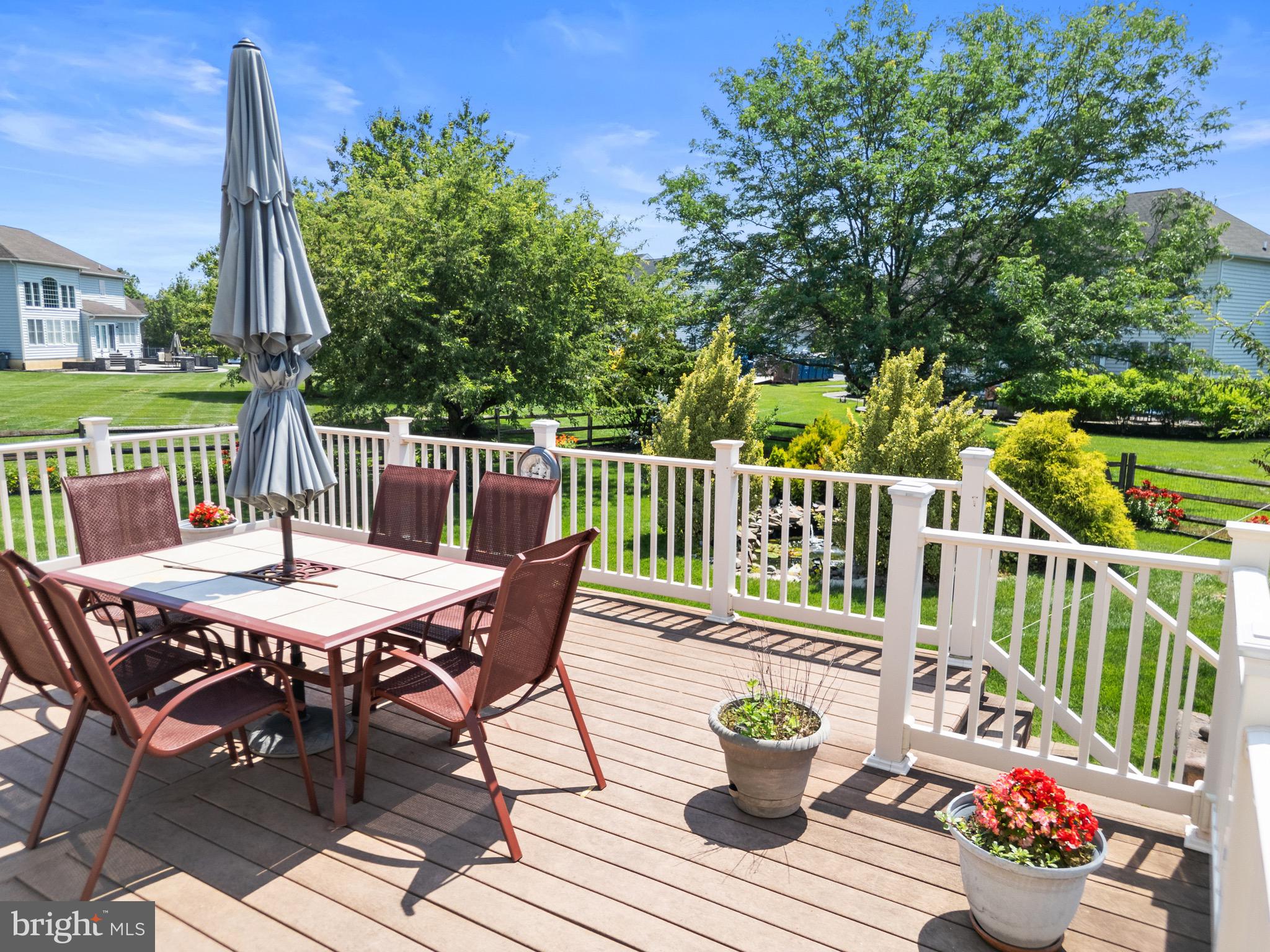 907 Mather Drive Bear, DE 19701 - Photo 11 of 80 a view of a table and chairs on the roof deck