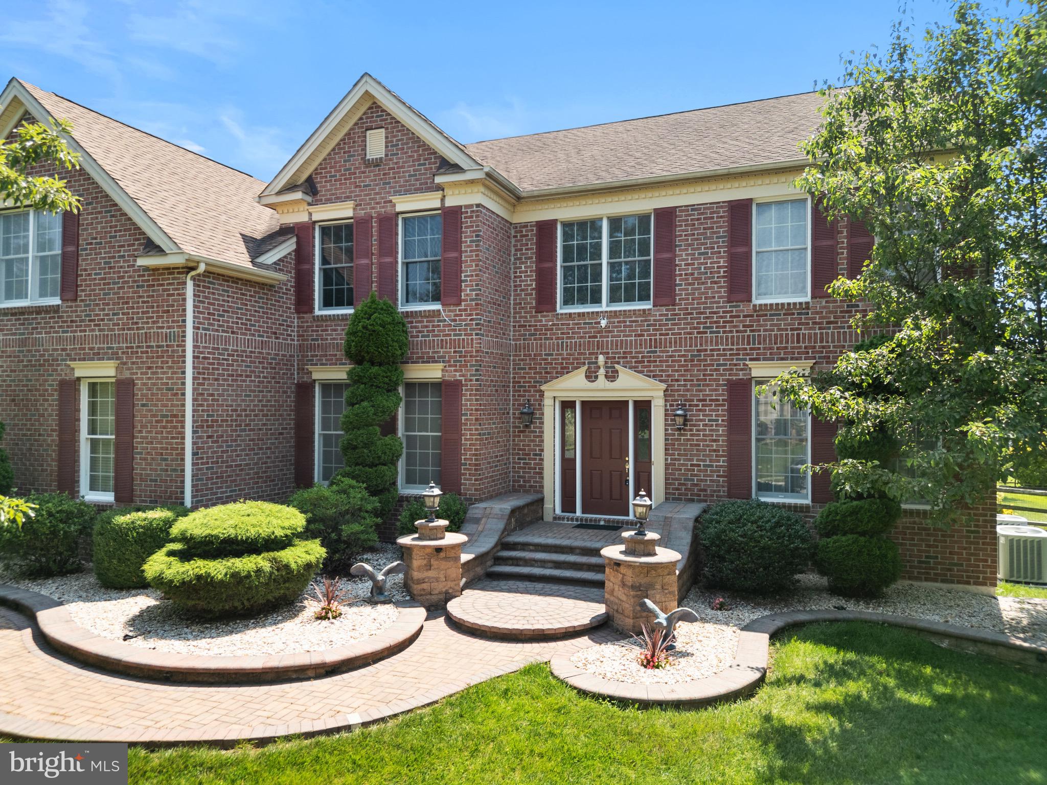 907 Mather Drive Bear, DE 19701 - Photo 2 of 80 a front view of a house with garden and trees
