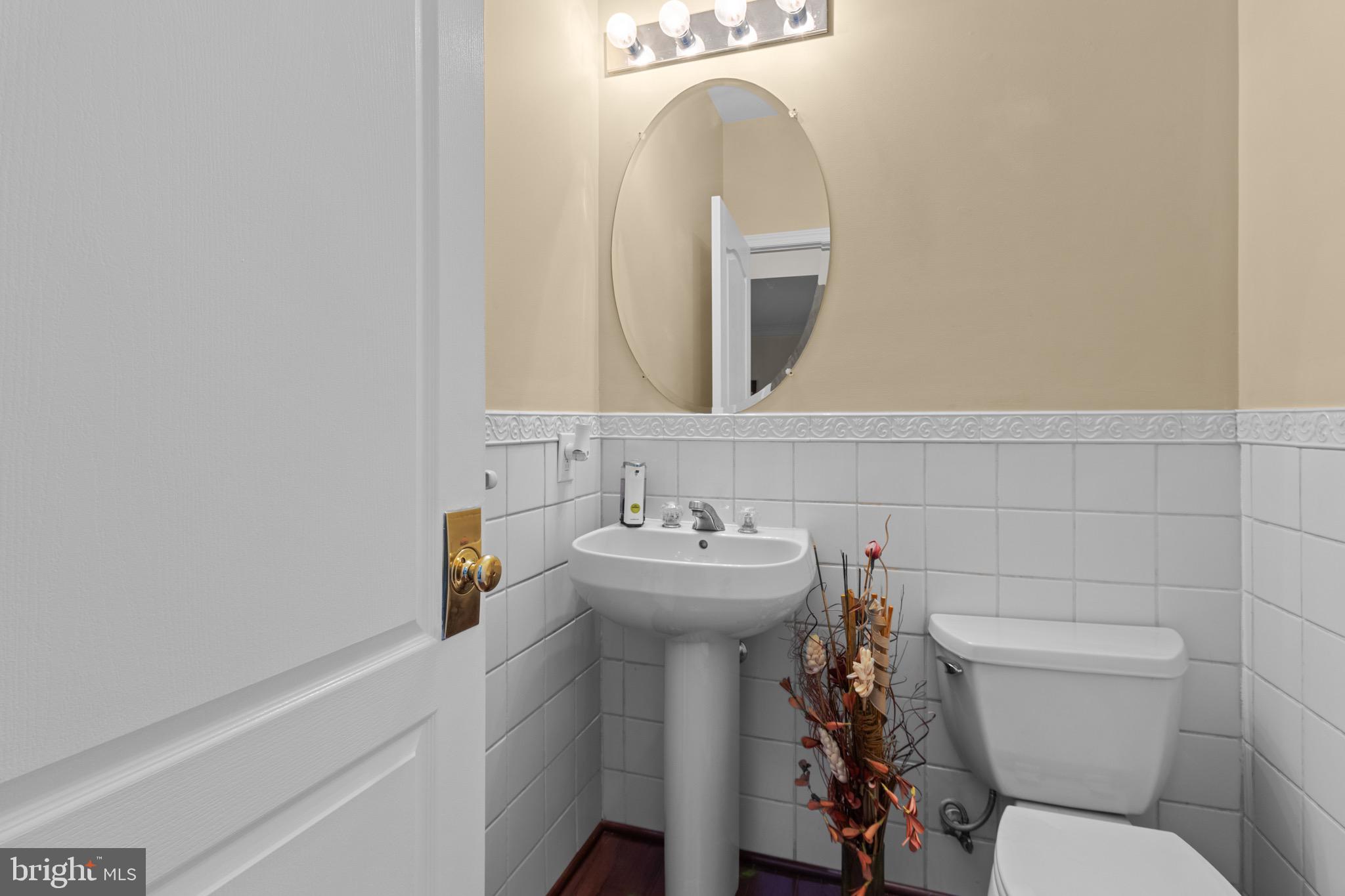 907 Mather Drive Bear, DE 19701 - Photo 48 of 80 a bathroom with a sink mirror toilet and view