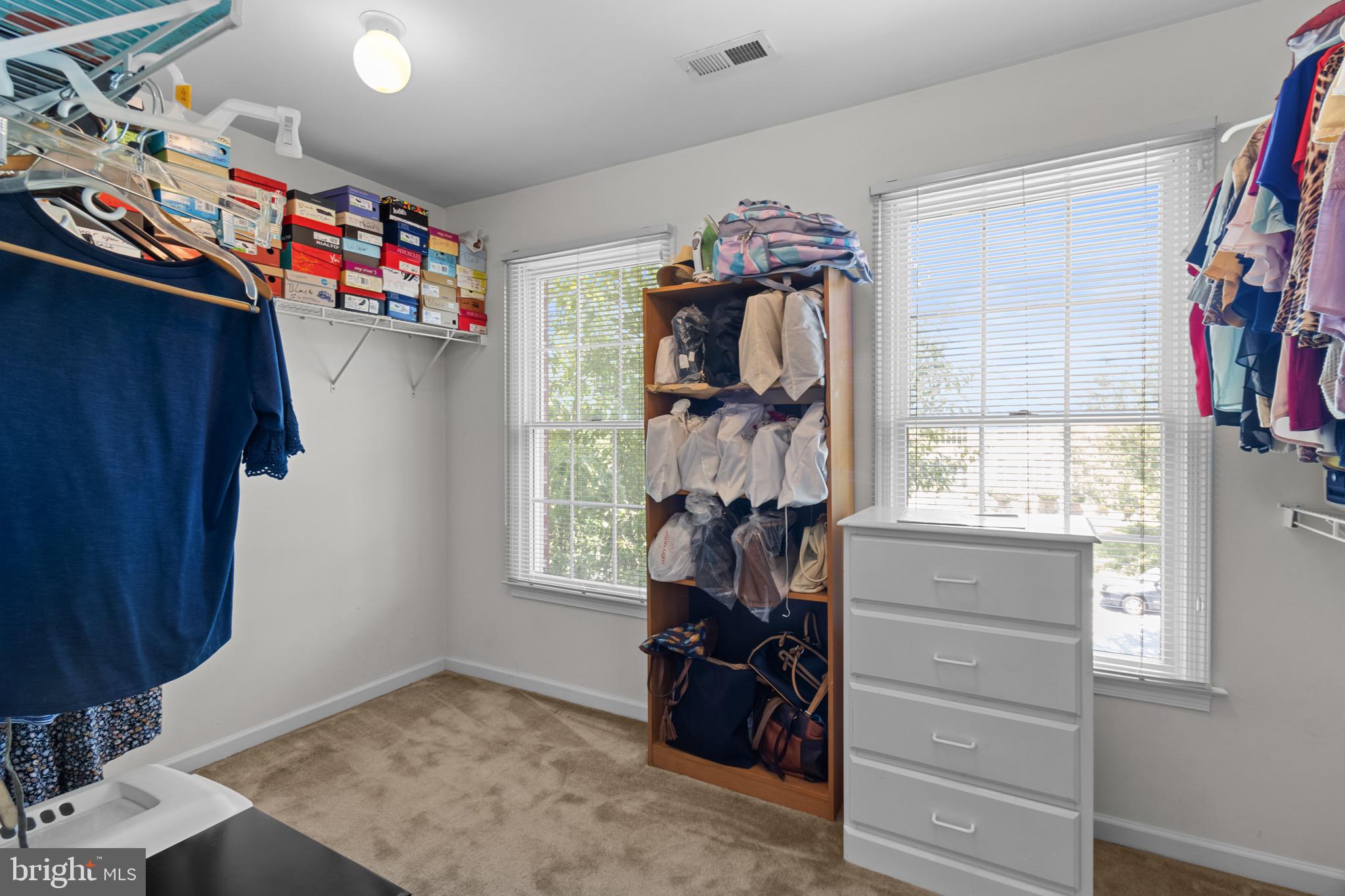 907 Mather Drive Bear, DE 19701 - Photo 65 of 80 a view of walk in closet with clothes and shoes