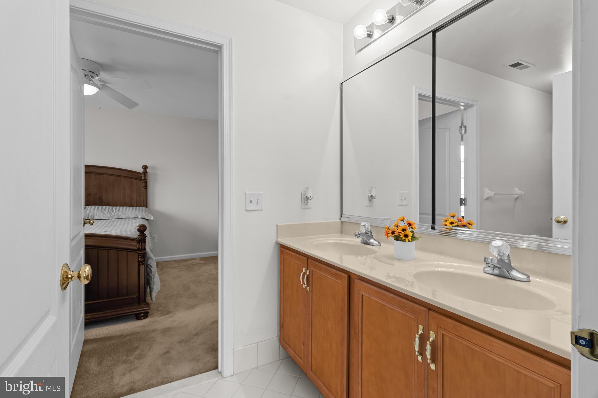 907 Mather Drive Bear, DE 19701 - Photo 71 of 80 a bathroom with a sink double vanity and a mirror