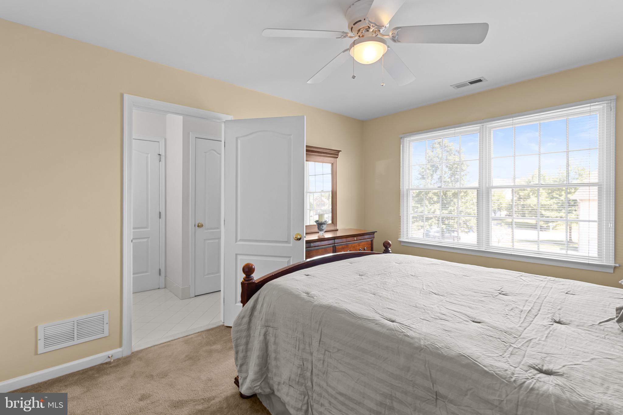907 Mather Drive Bear, DE 19701 - Photo 73 of 80 a spacious bedroom with a large bed and a window