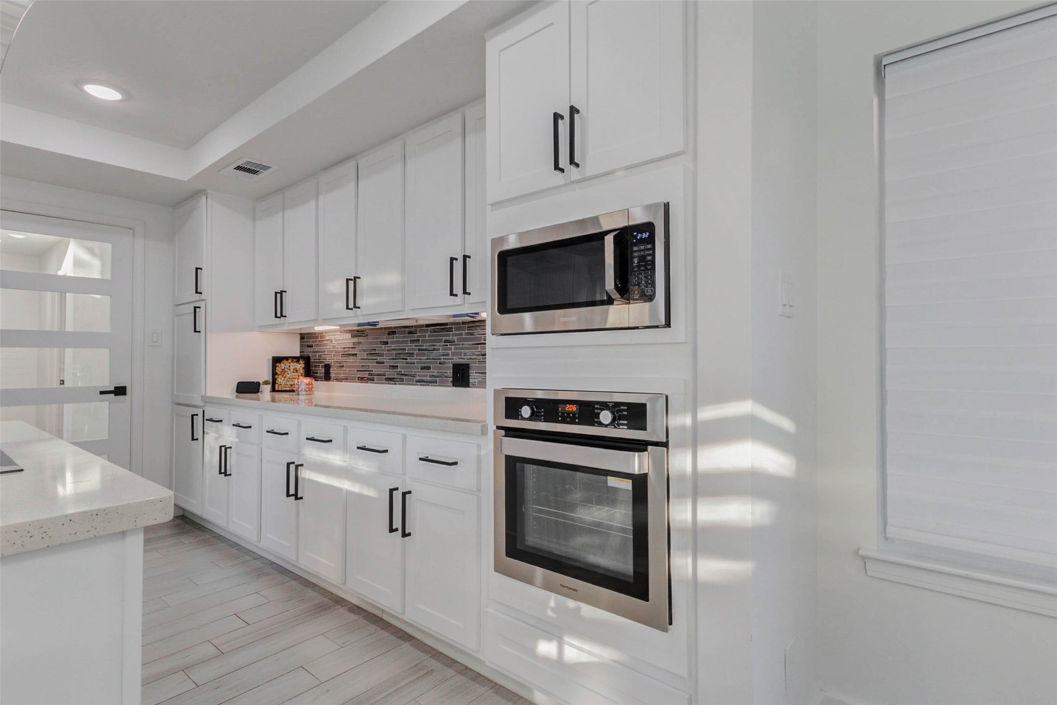2223 Foreland Drive Houston, TX 77077 - Photo 11 of 39 a kitchen with cabinets stainless steel appliances and sink