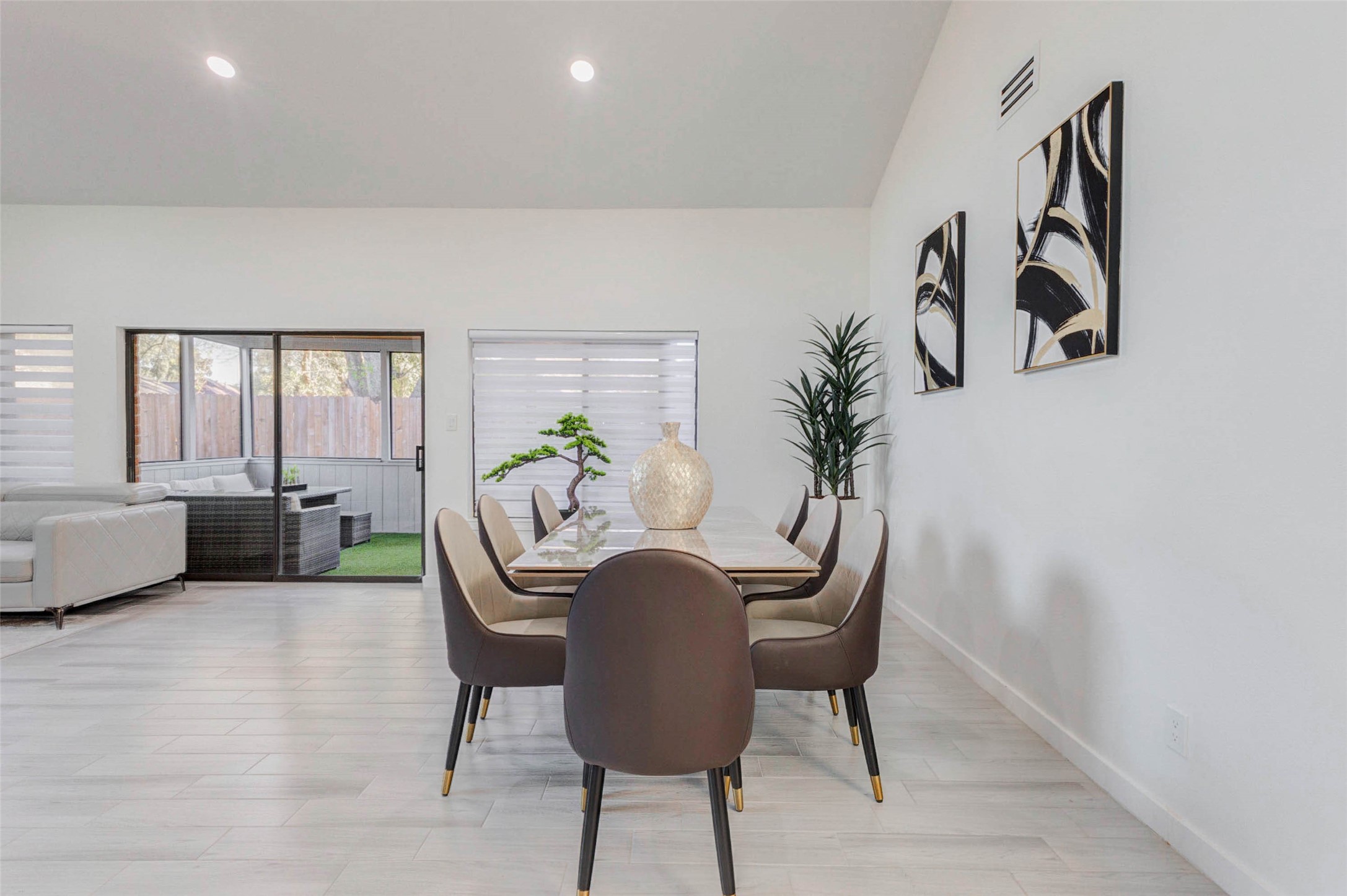 2223 Foreland Drive Houston, TX 77077 - Photo 16 of 39 a view of a dining room with furniture and a potted plant