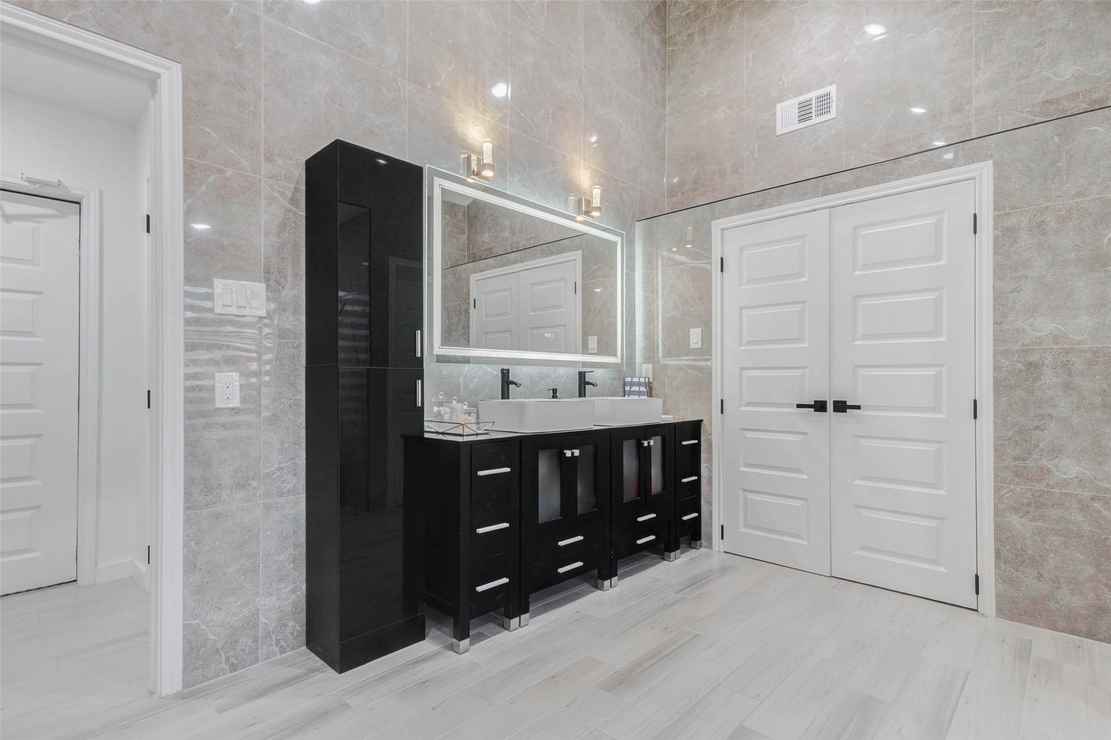 2223 Foreland Drive Houston, TX 77077 - Photo 24 of 39 a bathroom with a sink double vanity and a mirror
