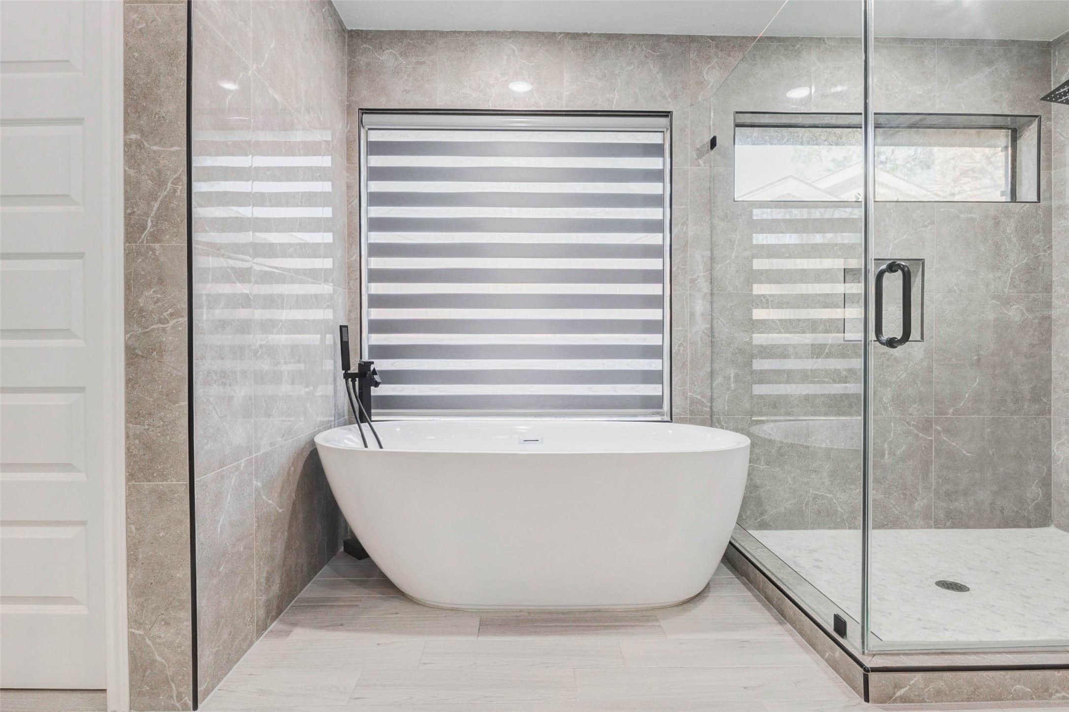 2223 Foreland Drive Houston, TX 77077 - Photo 26 of 39 a bathroom with a bathtub and a shower