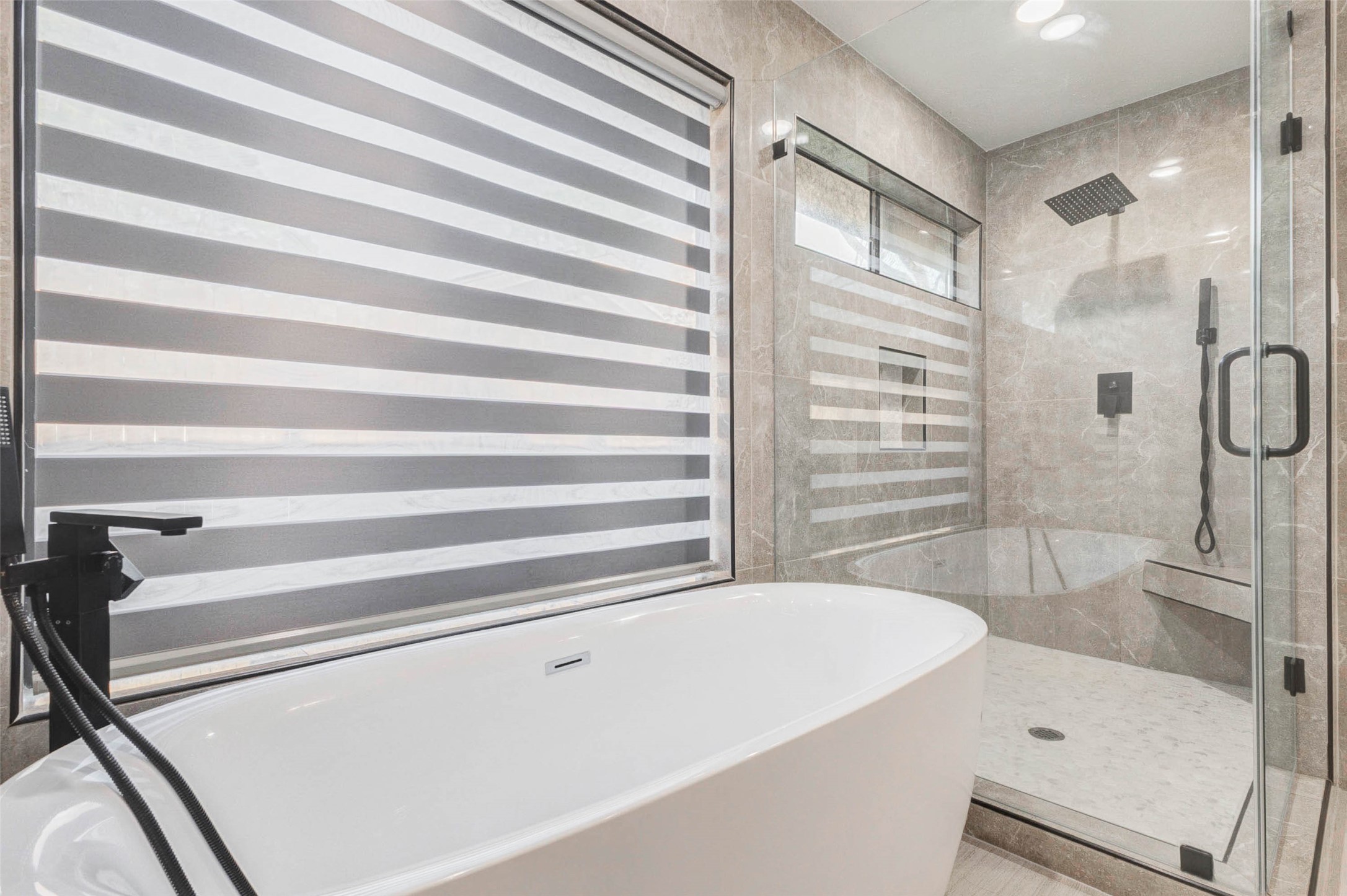 2223 Foreland Drive Houston, TX 77077 - Photo 27 of 39 a bathroom with a bathtub and a shower