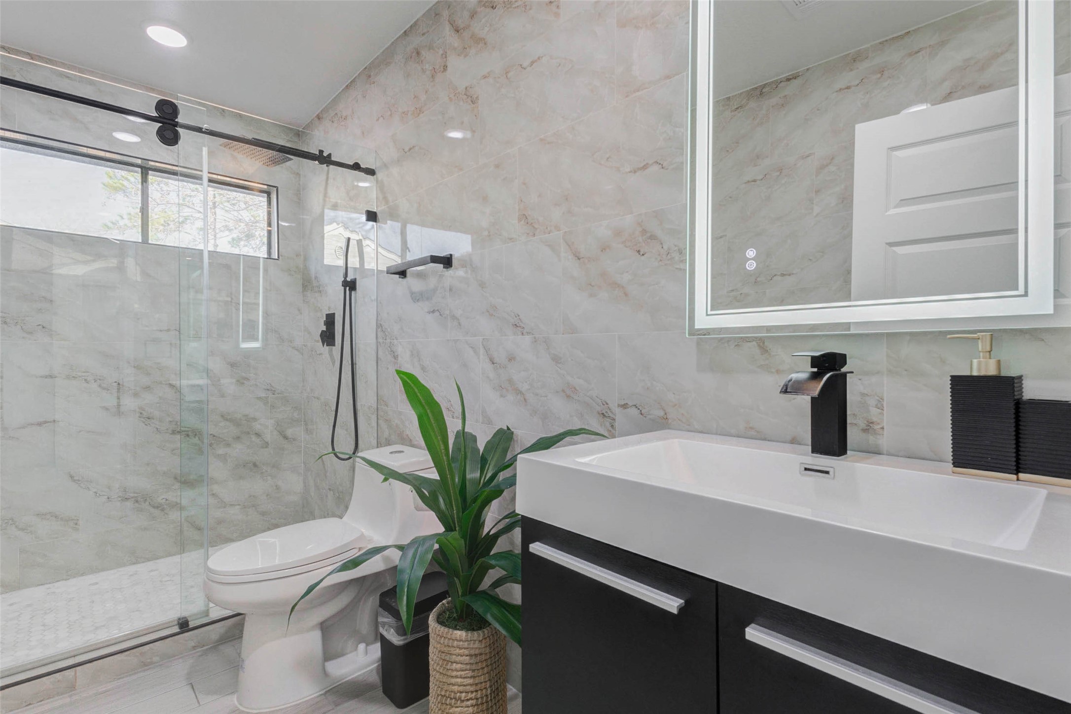 2223 Foreland Drive Houston, TX 77077 - Photo 32 of 39 a bathroom with a sink a toilet and shower