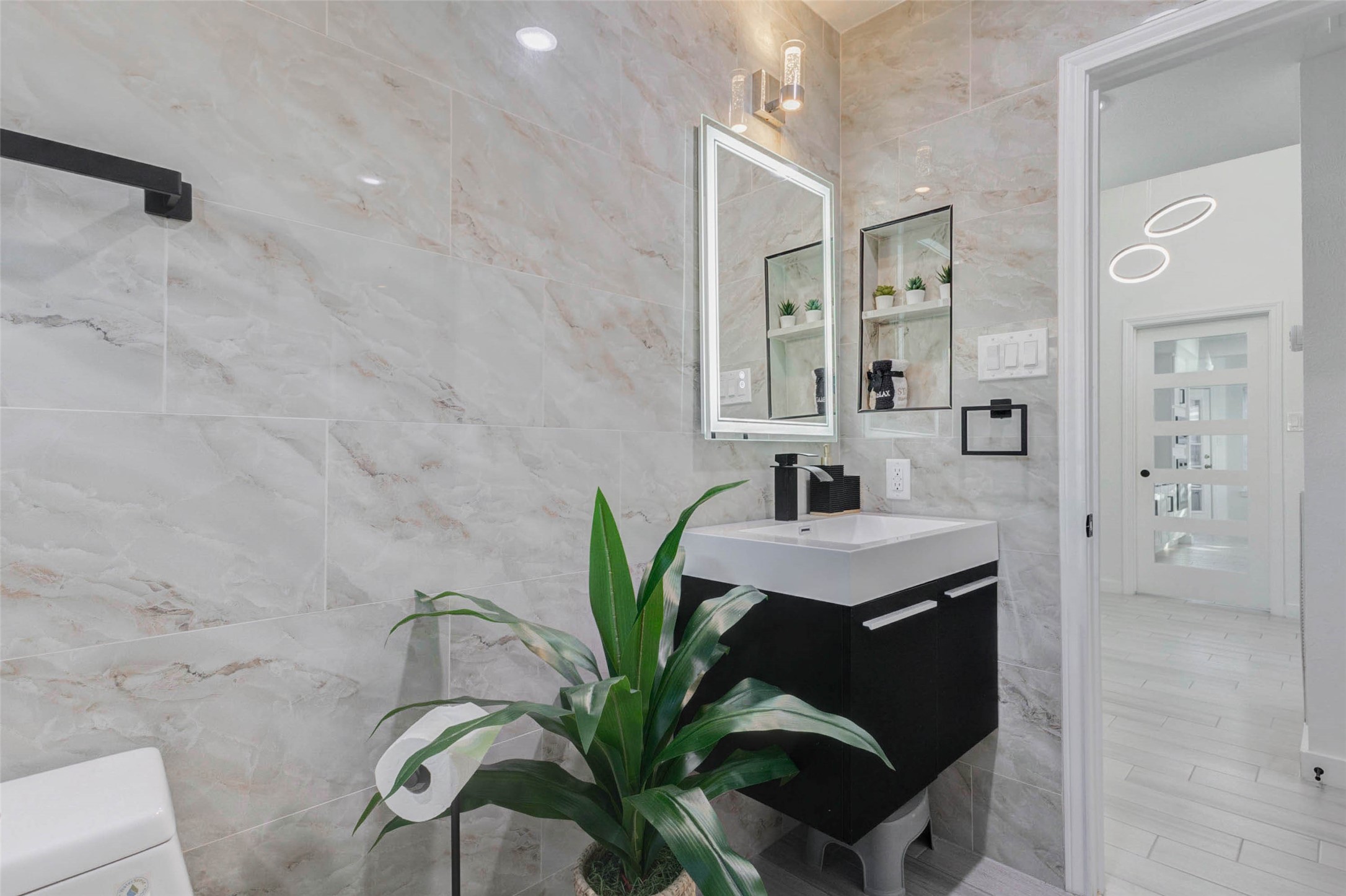 2223 Foreland Drive Houston, TX 77077 - Photo 33 of 39 a close view of a faucet a sink and a mirror