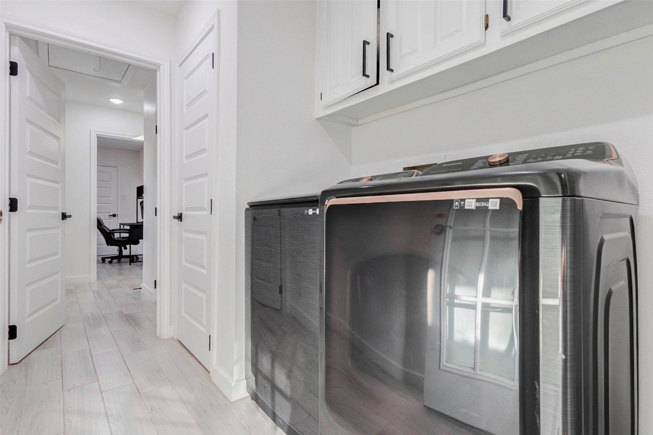 2223 Foreland Drive Houston, TX 77077 - Photo 34 of 39 a view of a livingroom with wooden floor and a fireplace