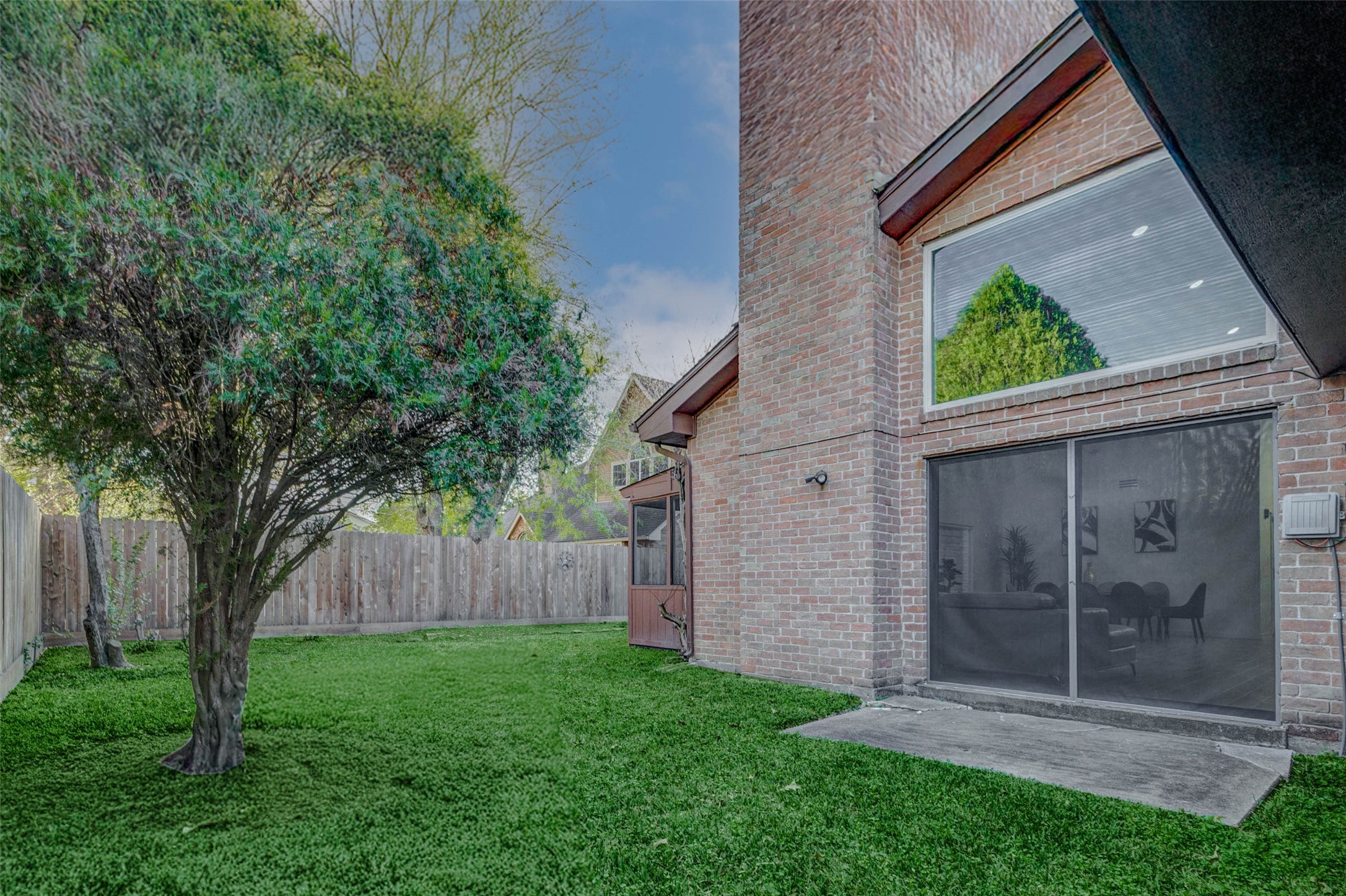 2223 Foreland Drive Houston, TX 77077 - Photo 38 of 39 a view of backyard with large trees and a small yard