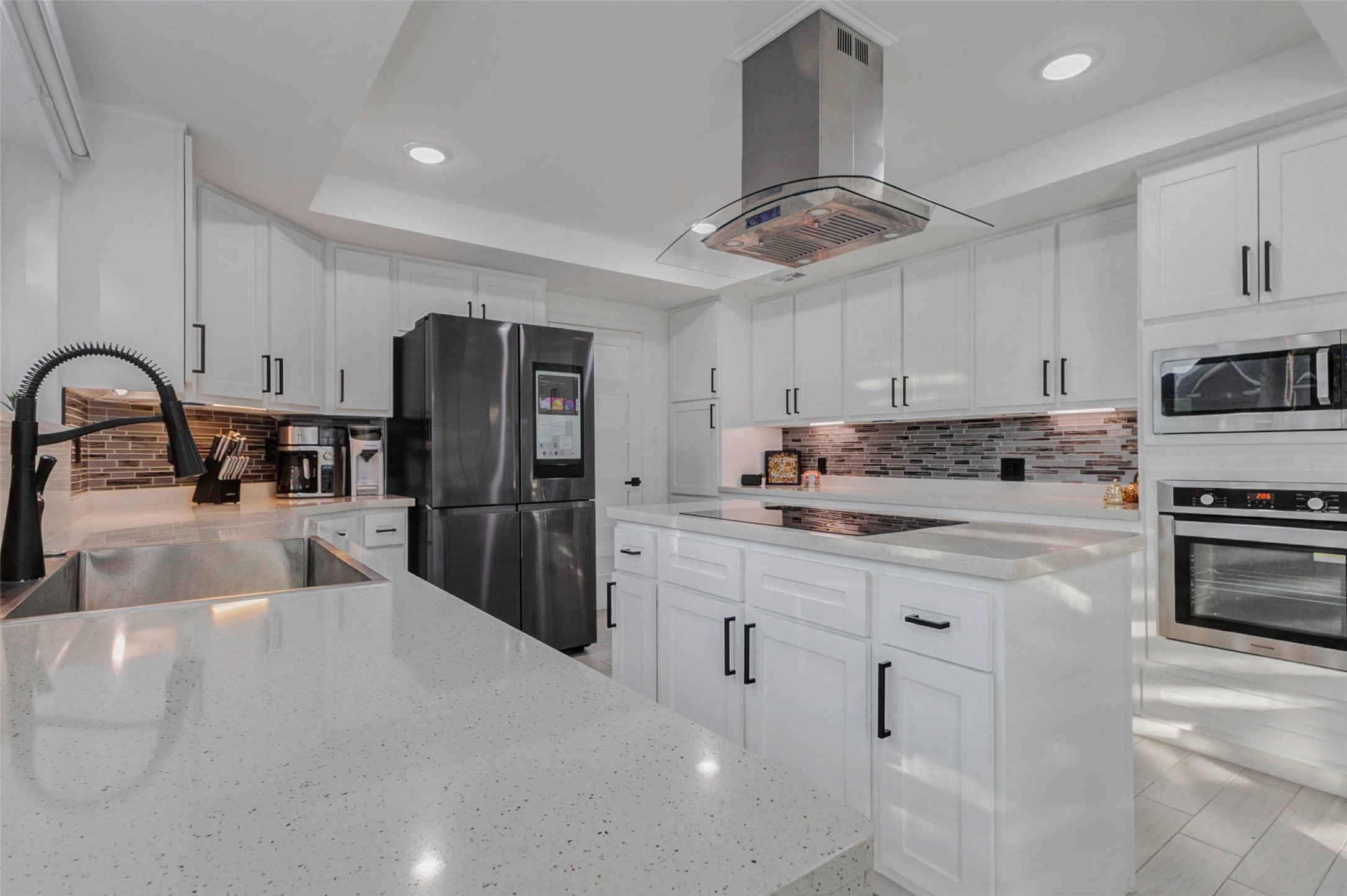2223 Foreland Drive Houston, TX 77077 - Photo 10 of 39 a kitchen with stainless steel appliances a refrigerator sink and cabinets