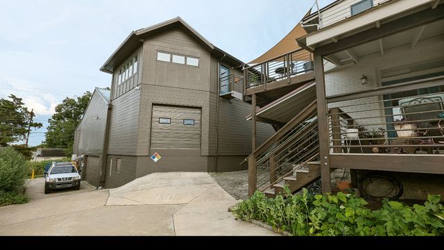 an aerial view of a house with a backyard