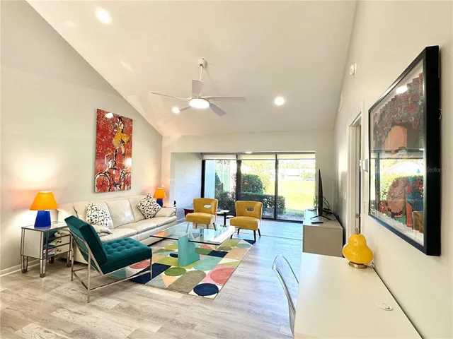a kitchen with stainless steel appliances a stove a sink and a microwave