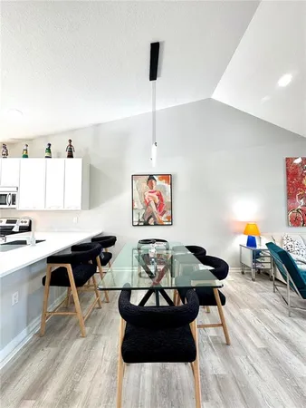 a living room with furniture and large flat screen tv
